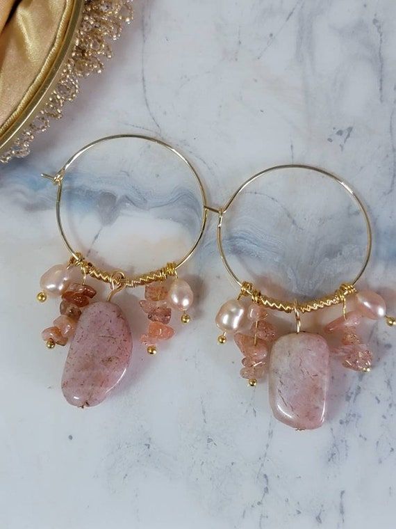 Check out this item in my Etsy shop https://www.etsy.com/listing/1240503769/sunstone-dangle-pearl-drop-earrings-14k Handmade Pink Gold-plated Jewelry, Handmade Blush Earrings As A Gift, Blush Dangle Earrings For Gift, Rose Gold Dangle Earrings With Rose Quartz, Pink Dainty 14k Gold Filled Earrings, Handmade Rose Gold Dangle Earrings, Handmade Rose Gold Dangle Jewelry, Handmade Elegant Pink Opal Jewelry, Pink Pearl Jewelry With Natural Stones