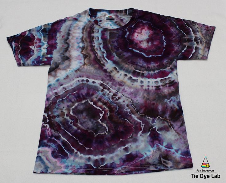 a t - shirt with purple and blue swirls on it