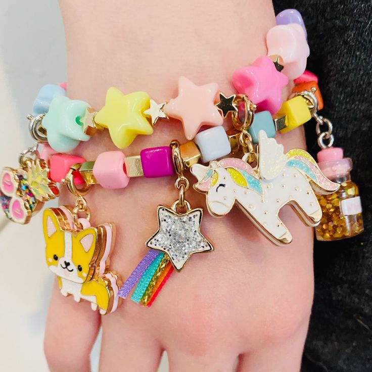 This star stretch bead charm bracelet is naturally the star of her charm bracelet stack! Add charms between the beads of this bracelet and customize her collection! features & materials Base Metal Acrylic 6" length WARNING: Choking Hazard - Small parts. Not for children under 3 years. Bracelet only, charms sold separately Charm Bracelet Stack, Decoupage Tins, Custom Charm Bracelet, Charm It, Bottle Charms, Kawaii Jewelry, Bead Charm Bracelet, Framed Gifts, Toy Sale