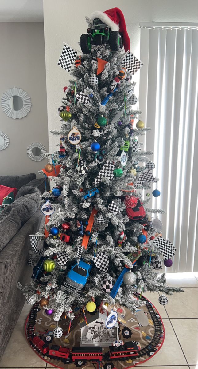 a christmas tree decorated with cars and ornaments