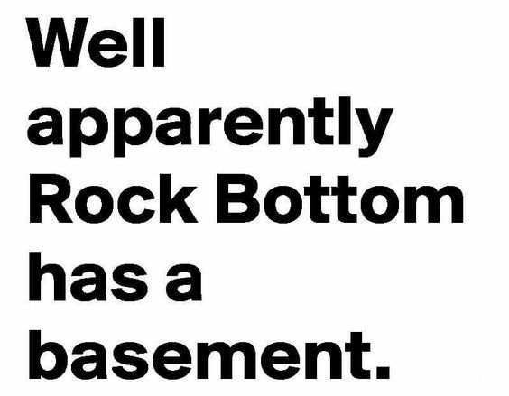 a black and white sign with the words well apparently rock bottom has a basement