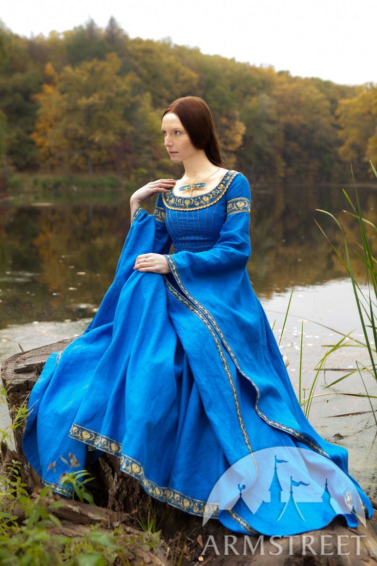 Blue medieval dress "Lady of the Lake". Available in: green flax linen, blue flax linen, black flax linen, midnight flax linen, violet flax linen, violet flax linen with silver accents, blue pomegranate trim, violet pomegranate trim, limited halloween wild pumpkin trim :: by medieval store ArmStreet Blue Medieval Dress With Historical Design, Medieval Blue Dress With Historical Design, Traditional Dresses For Medieval Festivals Weddings, Traditional Wedding Dresses For Medieval Festivals, Blue Medieval Dress, Medieval Dress Diy, Medieval Dress Princess, Ice Blue Dress, Medieval Dress Pattern