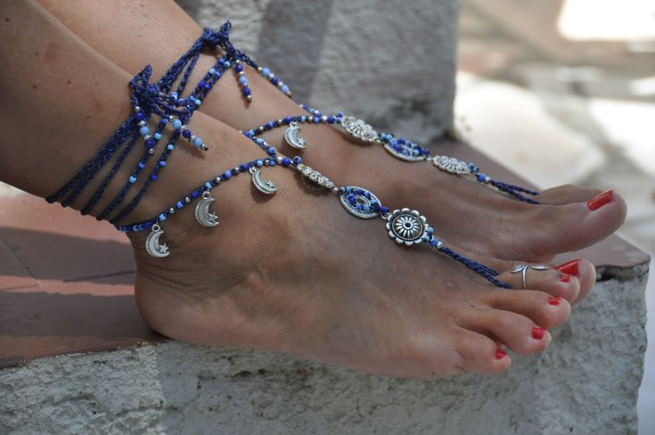 This listing is for a PAIR of barefoot sandals and ONE toe ring. Beautiful and unique barefoot sandals with a tribal vibration. They look great as necklace or on the hands too :) Handmade crocheted with love and care using waxed polyester cord, silver flower links, tibetan silver moon charms, tibetan silver bedas and glass beads. The lace is long enough to wrap it 2 times around the leg. These resistant sandals are suitable for many environments. They will embellish your feet and you can wear it Blue Open Toe Barefoot Sandals For Party, Blue Bohemian Anklets For Party, Blue Beaded Bohemian Anklets, Blue Ankle Wrap Anklets For Festival, Blue Bohemian Ankle Wrap Anklet, Bohemian Blue Beaded Anklets, Blue Barefoot Sandals For Summer Party, Bohemian Beaded Adjustable Toe Ring Sandals, Adjustable Beaded Bohemian Toe Ring Sandals