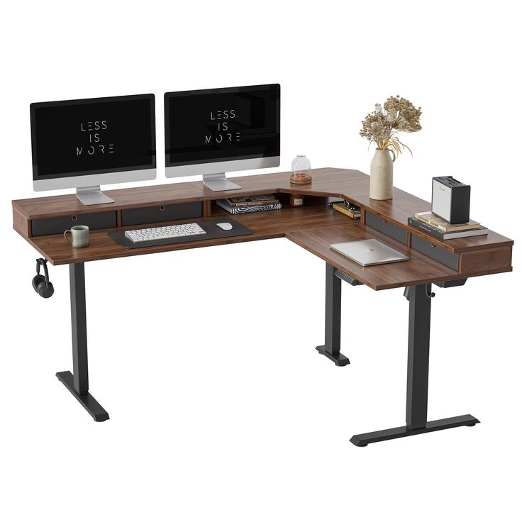 two computer monitors sitting on top of a wooden desk