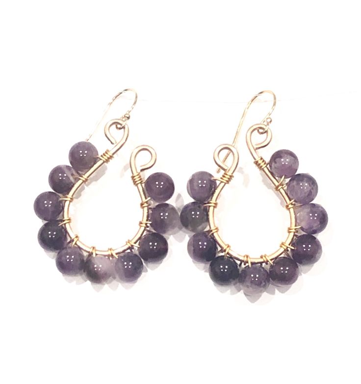 Gorgeous chevron amethyst round beads are wire wrapped by hand to sterling silver tulip shaped earrings. Ear wires are sterling silver, but can be custom made w/ stainless steel if preferred. Perfect for making your everyday grind just that much better. These beauties measure about 2 inches. But they are all made by me so each pair may be slightly different. can also be made with 14k gold fill instead. Wire Wrapped Amethyst Round Bead Jewelry, Wire Wrapped Amethyst Round Earrings, Amethyst Wire Wrapped Round Earrings, Amethyst Wire Wrapped Drop Earrings, Adjustable Wire Wrapped Purple Beaded Earrings, Purple Wire Wrapped Drop Beaded Earrings, Adjustable Purple Wire Wrapped Beaded Earrings, Purple Wire Wrapped Drop Earrings, Wire Wrapped Amethyst Drop Earrings