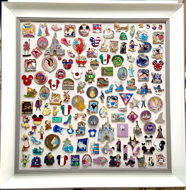 a white frame filled with lots of different types of magnets