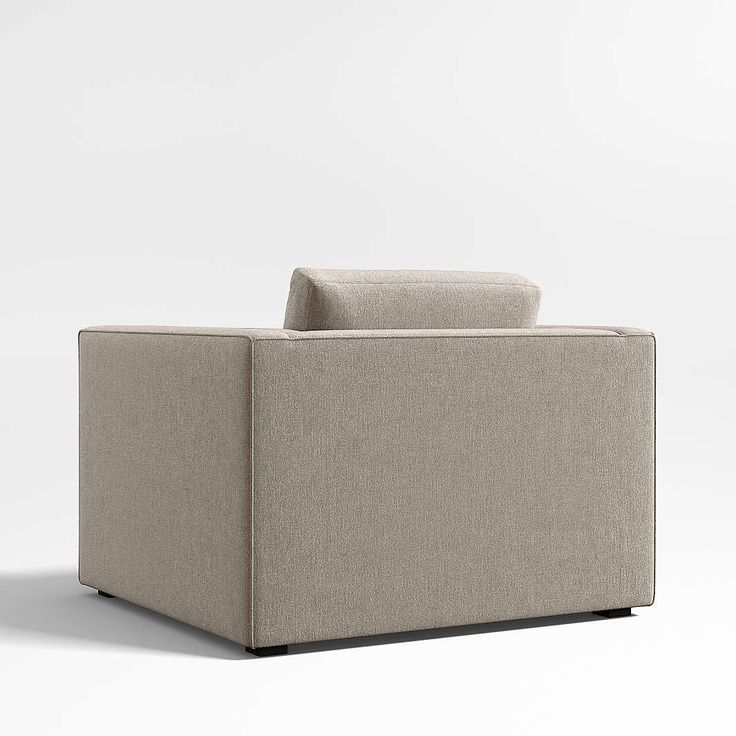 a beige couch sitting on top of a white floor