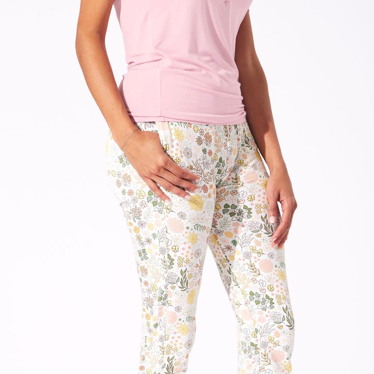 Embrace the crisp autumn vibes with our Fall Floral Bamboo Women's Pajama Set. Featuring a charming floral print in warm hues, these pajamas offer the perfect blend of style and comfort. Made from luxurious bamboo fabric, they're soft, breathable, and eco-friendly. Snuggle up in sustainable fashion this season! Stylish and Functional Top: Scoop neck long-sleeve top with elegant snaps, making it both stylish and convenient for breastfeeding. Practical Pockets: Jogger-style pants with deep pockets Comfortable Floral Print Sleepwear, Spring Floral Print Sleepwear For Relaxation, Spring Multicolor Floral Print Sleepwear, Spring Sleepwear With 3/4 Sleeves, Spring Long Sleeve Nursing-friendly Sleepwear, Womens Pyjama Sets, Fashion Joggers, Bamboo Fabric, Pretty Design