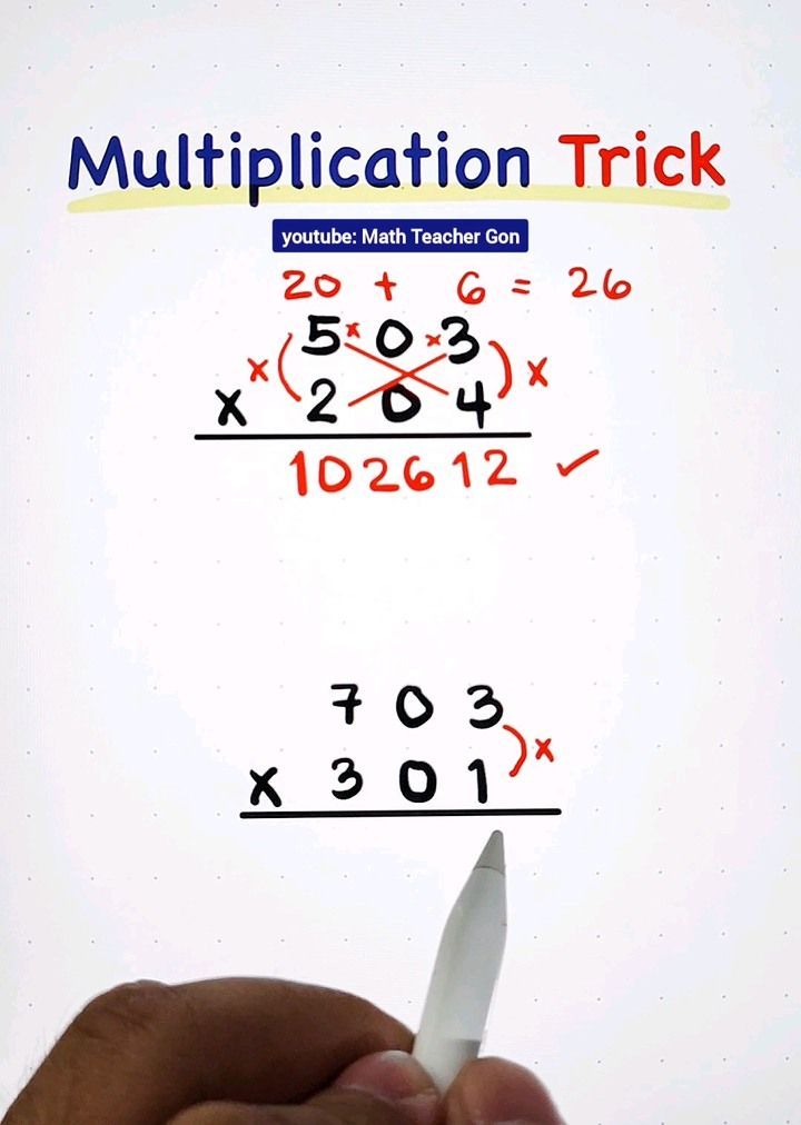 a hand holding a piece of paper with numbers on it and the word multiplication trick written below