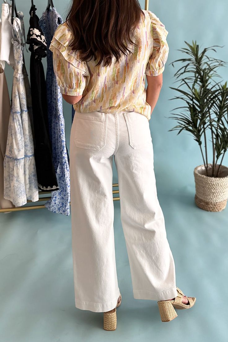 Get ready to slay in these white utility pants! With a chic high waist and large front pockets, these wide leg trouser jeans are both stylish and functional. Perfect for taking your outfit to the next level, these pants will become your go-to for any occasion. Stocked at Uptown. Spring White Jeans With Pockets, Trendy White Pants With Pockets, Trendy White Straight-leg Jeans, White Full-length Cotton Cargo Pants, White Pants With Pockets For Spring, White Cotton Full-length Cargo Pants, White Full Length Cotton Cargo Pants, White Cotton Full Length Cargo Pants, White Full-length Flare Jeans For Spring