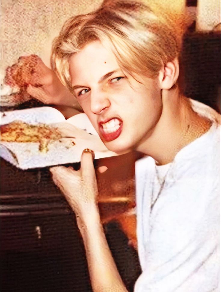 a woman eating food with her mouth wide open