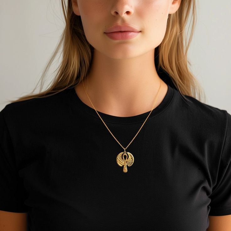 This solid gold key of Ankh necklace showcases exquisite craftsmanship, symbolizing life and spirituality. The key of Ankh pendant is more than just jewelry; it's a fine representation of ancient Egyptian elegance and the timeless allure of this sacred symbol. PENDANT INFORMATIONThis pendant is made of real, solid gold.• Made in USA• Material: 14k or 18k solid gold• Finish: polished• Height: 1.25" (31,5 mm) x Width: 1" (26,5 mm)• Pendant weight: approx. 6 grams (14k)• Bail: fits up to 4 mm chain Elegant Ankh-shaped Gold Jewelry, Luxury Gold Ankh Jewelry, Yellow Gold Ankh Necklace, Elegant Ankh Yellow Gold Jewelry, Elegant Yellow Gold Ankh Jewelry, Spiritual Ankh Jewelry With Large Pendant, Spiritual Ankh Pendant Jewelry, Elegant Ankh-shaped Hallmarked Necklace, Ankh Pendant