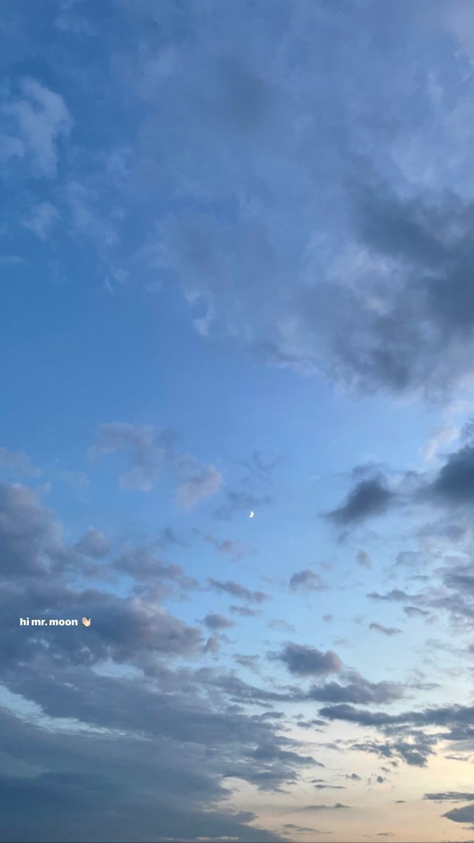 an airplane is flying high in the sky above the ocean at sunset or sunrise time