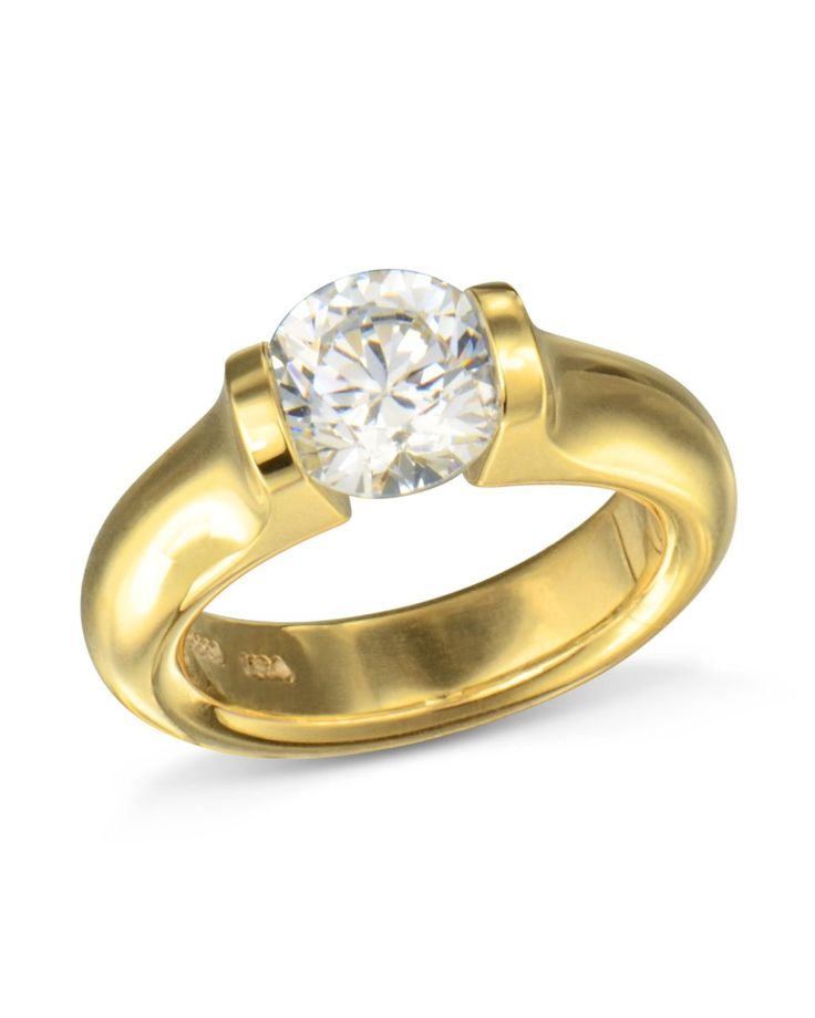 An impressive Medium Omega Tension Set Diamond Ring by Steven Kretchmer.Hand-fabricated in 18k yellow gold, the classic Omega engagement ring design is what put Steven Kretchmer on the map.  Elegant curves, substantial feel with a tension set diamond center that embraces light in a magical way.  This diamond ring has it all.Steven Kretchmer is an award-winning jewelry designer often referred to as the most innovative designers to hit the jewelry scene.Tension set rings are comfortable to w Luxury Rose Gold Ring With Tension Setting, Classic Yellow Gold Jewelry With Tension Setting, Formal Round Band With Tension Setting Jewelry, Formal Round Band Jewelry With Tension Setting, Formal Jewelry With Tension Setting Round Band, Classic Rings With Tension Setting And Wide Band, Formal Round Band With Tension Setting, Classic Wide Band Rings With Tension Setting, Formal Round Jewelry With Tension Setting