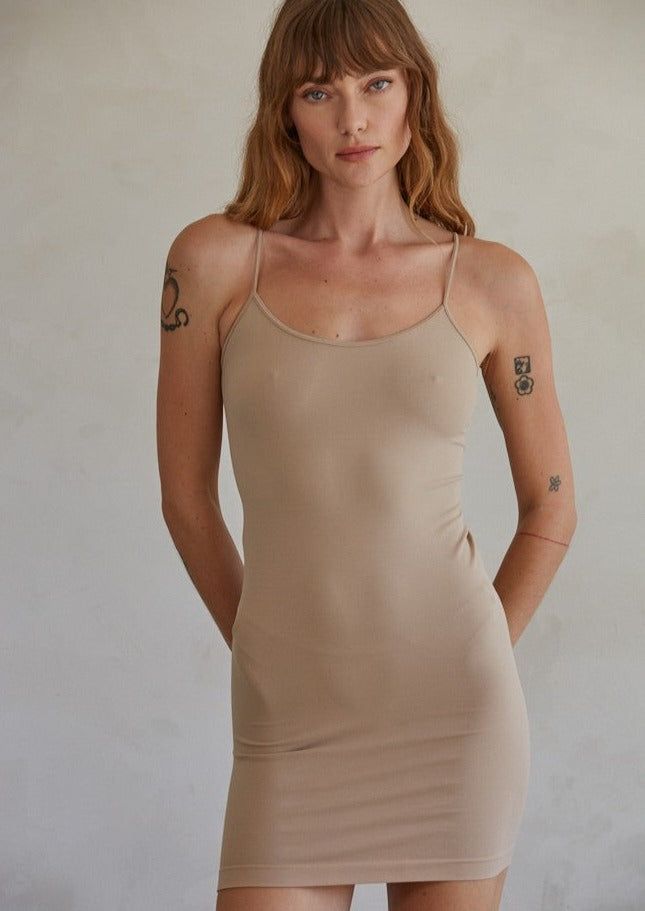 Basic Slip Dress, Light Taupe/Nude Perfect for layering under crochet, knits, or white dresses Beige Stretch Dress With Spaghetti Straps, Spring Seamless Stretch Mini Dress, Stretch Seamless Mini Dress For Spring, Seamless Summer Dresses For Daywear, Seamless Summer Day Dresses, Seamless Cami Bodycon Dress, Seamless Bodycon Cami Dress, Fitted Camisole Mini Dress For Daywear, Solid Camisole Dress With Seamless Design