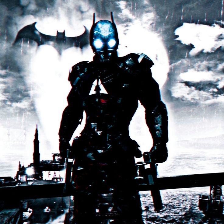 a man standing in front of a giant screen with batman on it's face