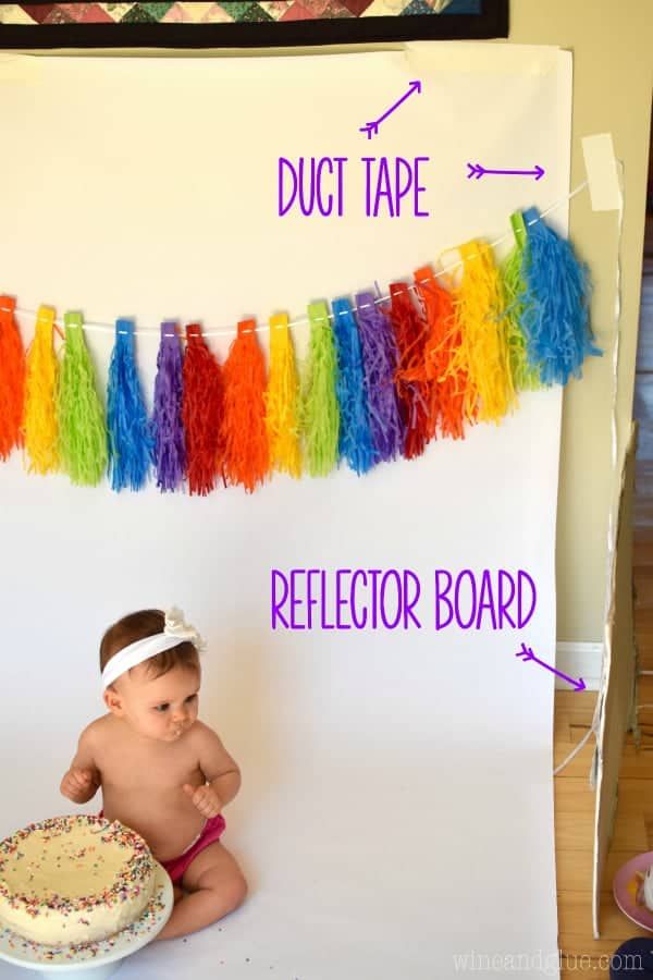 a baby sitting in front of a cake with duct tape on it and the words duct tape below