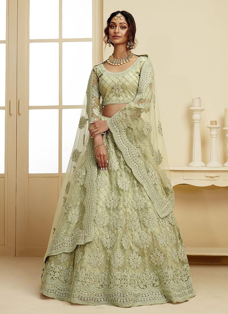 The detailing and magnetism of this soft net lehenga choli will make you fall in love with it instantly. With an illusion of heaviness but in reality a super light and agreeable attire, this adorable piece comes in hues of mint green with exquisite work done in cording embroidery & stonework. Pick this and be the next trendsetter. #EmpressClothing #Lehenga #LehengaCholi #WeddingLehenga #BridalWear #Bridal #TrendyLehenga #trending #Trendsetter #weddingseason #WeddingBells #BridalWear Lehenga Green, Green Lehenga Choli, Indian Wedding Lehenga, Indian Lehenga Choli, Bollywood Lehenga, Dress Sage, Wedding Green, Green Lehenga, Net Lehenga