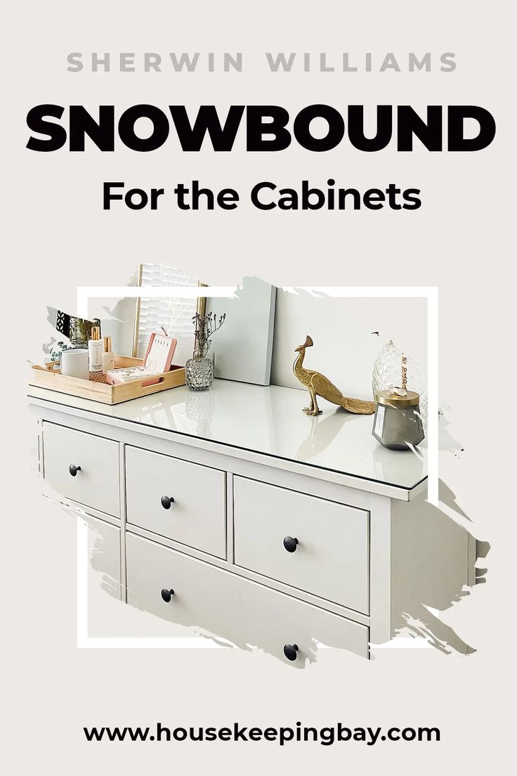 there is a white dresser with the words snowbound for the cabinets