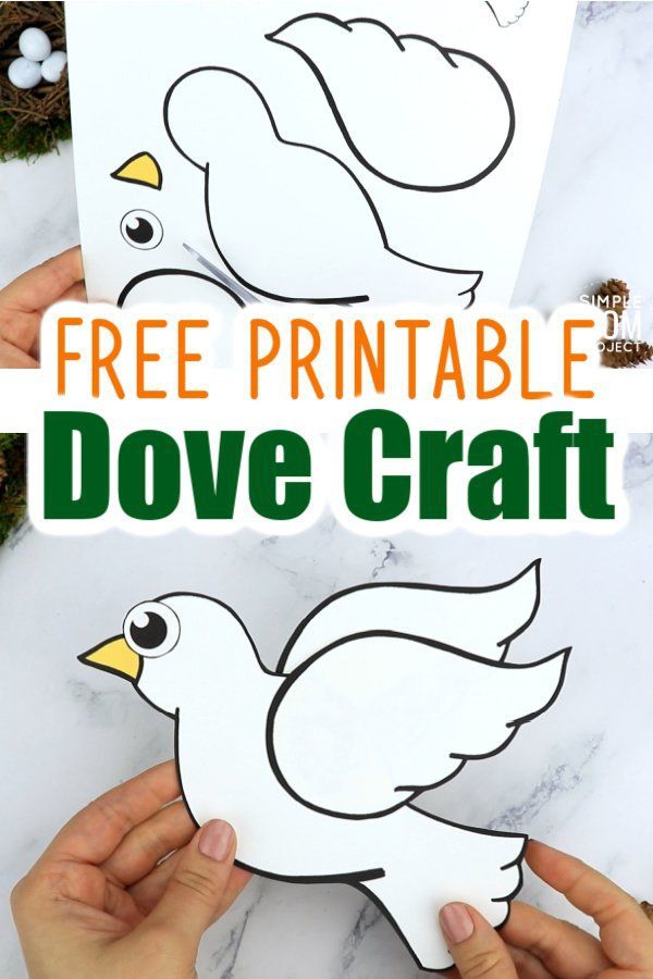 hands holding up a paper dove craft with the words free printable dove craft on it