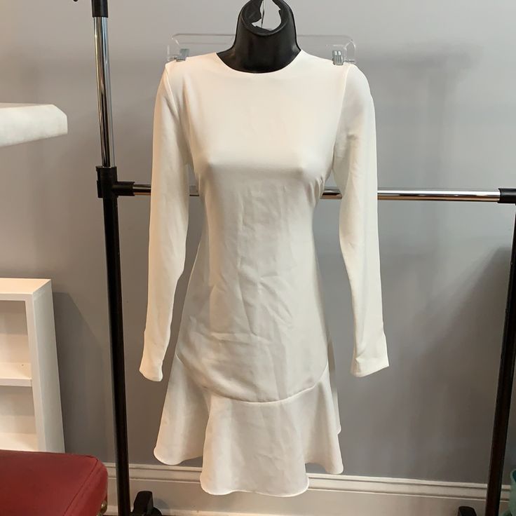 Great Dress For Your Rehearsal/Engagement Dinner, A B/W Party Or Just A Night Out. Jewel Neck For Showing Off A Great Statement Piece. Appx. 34” Shoulder To Hem. New With Tags, Ruffle Accent, Designer Dress Size Small. Waist Is 15.5 Across (See Pic). White Midi Length Long Sleeve Dress For Brunch, White Fitted Long Sleeve Wedding Dress, Feminine Fitted Long Sleeve Dress For Brunch, White Ruffle Hem Dress For Date Night, White Fitted Long Sleeve Dress For Formal Occasions, White Dress With Ruffle Hem For Date Night, White Midi Dress With Ruffle Hem For Date Night, Fitted White Dress With Ruffle Hem, White Ruffle Hem Midi Dress For Evening