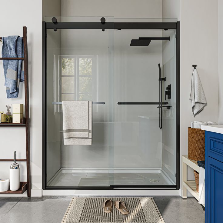 a walk in shower sitting next to a blue cabinet