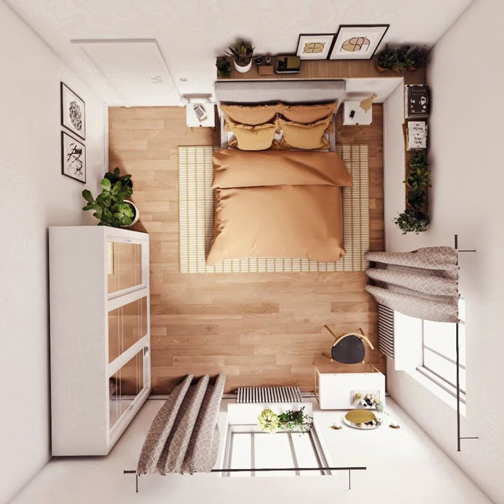 an overhead view of a bedroom with a bed and desk