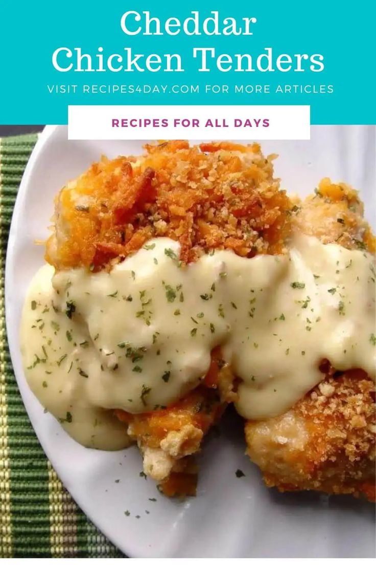 a white plate topped with fried chicken covered in gravy and mashed potatoes