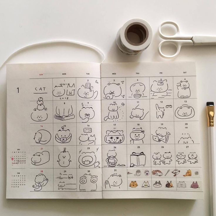 an open notebook with drawings on it next to a cup of coffee