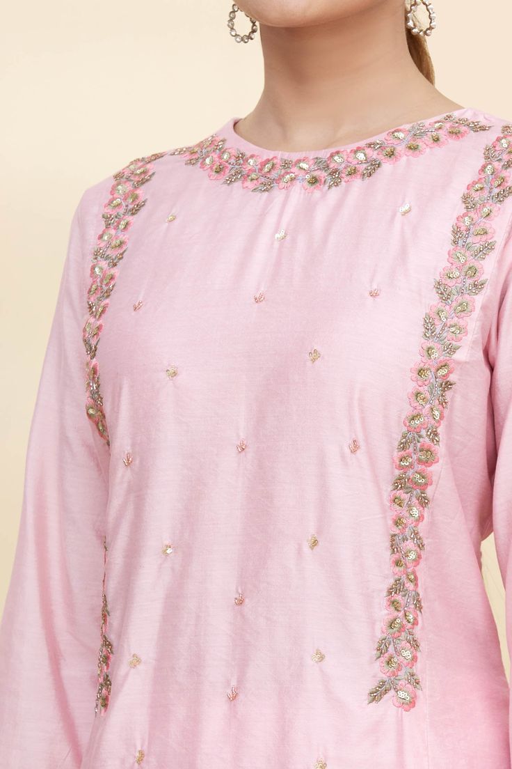 Baby pink chanderi kurta with floral embroidery, embellished yoke, round neckline and full sleeves. Comes with straight fit pant and printed organza dupatta.
Component: 3
Printed, Embroidered
Neckline: Round
Sleeve Length: Full
Fabric: Kurta and Pant: Chanderi; Dupatta:  Organza
Color: Pink
Keyhole at the back with button closure
Straight fit pant
Printed dupatta with lace trim - Aza Fashions Embellished Long Sleeve Chanderi Kurta, Pink Raw Silk Kurta With Mirror Work, Designer Raw Silk Embellished Kurta, Semi-stitched Embellished Raw Silk Kurta, Designer Embellished Raw Silk Kurta, Embellished Semi-stitched Raw Silk Kurta, Embellished Fitted Kurta In Raw Silk, Embellished Fitted Chanderi Kurta, Traditional Embellished Embroidered Top For Wedding