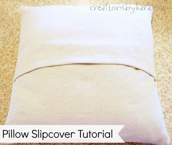 a pillow that is laying on the floor with text overlay reading pillow slipcover tutorial