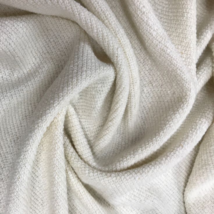 a close up view of a white fabric