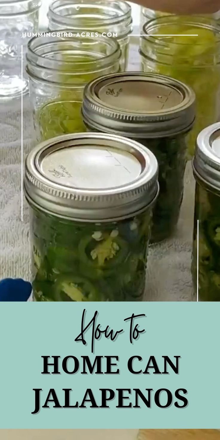 jars filled with pickles sitting on top of a table