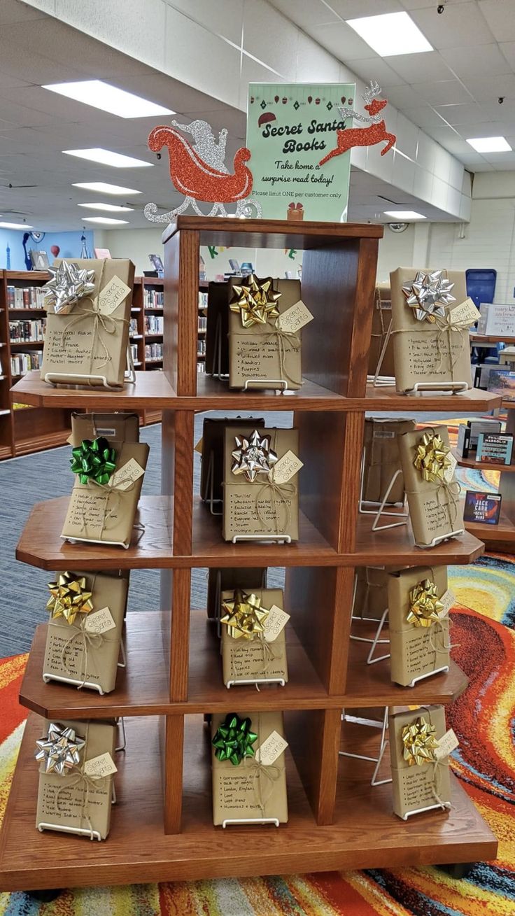 the shelves are decorated with gift bags and bows for christmas time at the library's children's book store