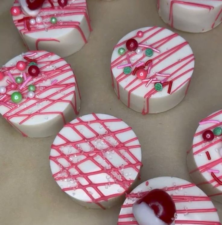 several decorated cookies sitting on top of a table