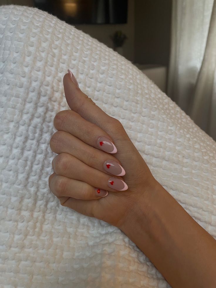 Valentine’s Day | Galentine’s | Valentine Nails | Heart Nails | Gel Nails | Nail Inspo | Aesthetic | Summer | Hailey Bieber | Clean | Home | VSCO | Pinterest Fashion | French Manicure | Almond Nails | Tan | Cozy | Blonde Heart French Manicure, French Manicure With Hearts, French Red Heart Nails, French Manicure With Heart, Pink French Red Heart, Pink French Tip With Red Heart, Pink And Red Nails Valentines French Tips, Red French Tip With Heart On Ring Finger, Vday Nails