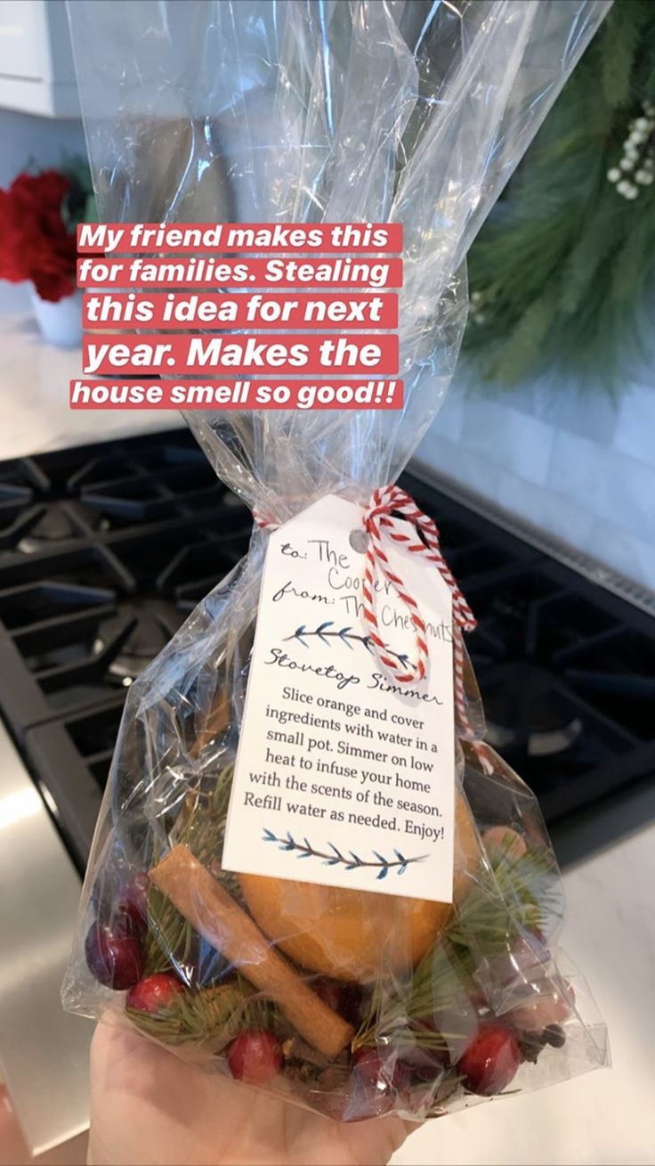 someone is holding up a bag with some food in it that says, my friend makes this for families stealing this idea for next year make the house smell so good