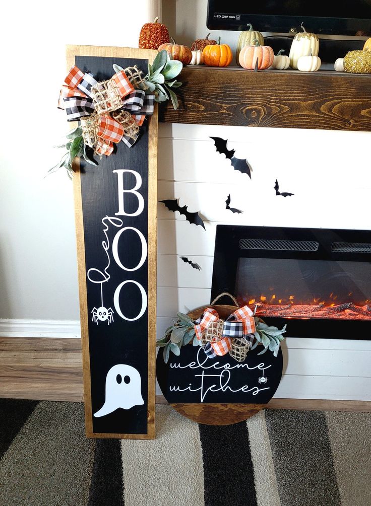 a fireplace decorated for halloween with pumpkins and decorations