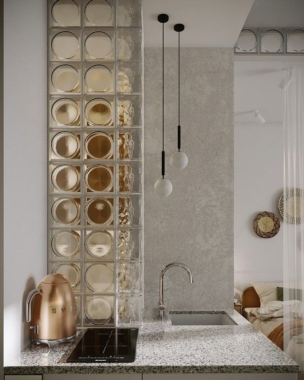 a modern kitchen with marble counter tops and stainless steel faucets in the corner