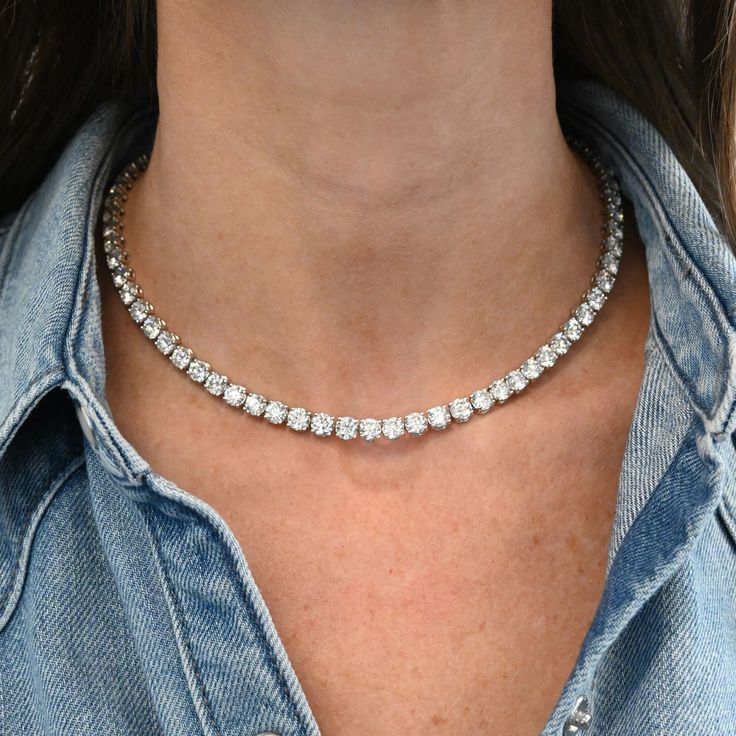 This 35 Carat Diamond Tennis Necklace exudes luxury, sophistication, and timeless beauty featuring 70 round diamonds. While undeniably luxurious, this necklace is versatile enough to complement a variety of ensembles. Available in 18K White Gold Diamond weight = 35.04 carats Diamond quality = GH, SI1-SI2 Luxury Gold Tennis Necklace For Engagement, Luxury Diamond Sparkling Necklace, Luxury Dazzling Diamond Necklace, Luxury Round Diamond Jewelry, Luxury Diamond Necklaces Tarnish Resistant, Luxury White Gold Rounded Jewelry, Luxury Silver Tennis Necklace, Luxury Round White Gold Jewelry, Luxury Round Tennis Necklace As Gift