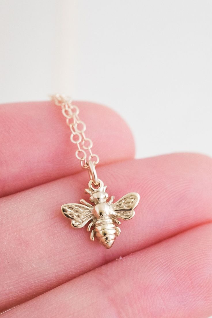 This little gold pendant necklace is dainty and sweet! Our Honey Bee Necklace features a teeny little bee, suspended on a gorgeous cable chain. We love it paired with our Queen Bee Necklace. Gold filled or sterling silver - it's perfect for everyday wear without tarnishing. AND it's affordable. Find more at Simple & Dainty! Cute Pendant Charm Necklace For Gift, Cute Sterling Silver Necklace For Everyday, Handmade Cute Charm Necklaces, Cute Charm Necklaces As Gift, Cute Charms Necklaces As Gift, Cute Charms Necklaces For Gifts, Cute Handmade Everyday Charm Necklaces, Cute Everyday Handmade Charm Necklaces, Cute Charms Necklace For Gift