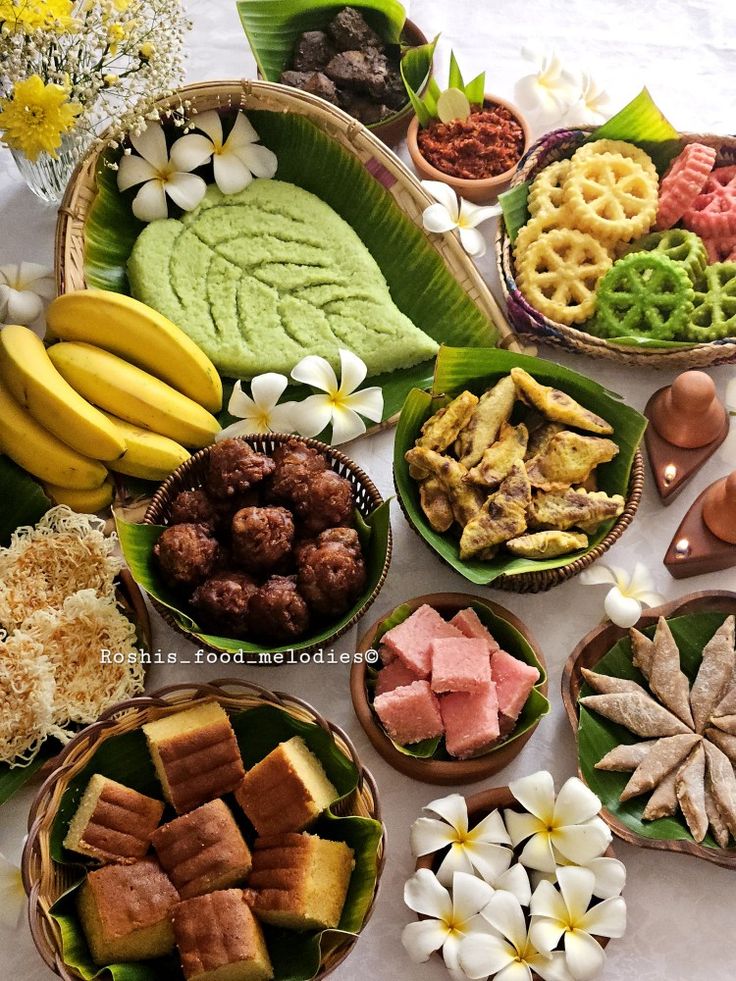 a table topped with lots of different types of foods and desserts next to each other