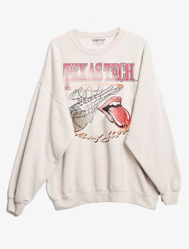 a white sweatshirt with an image of a bird and the words texas printed on it