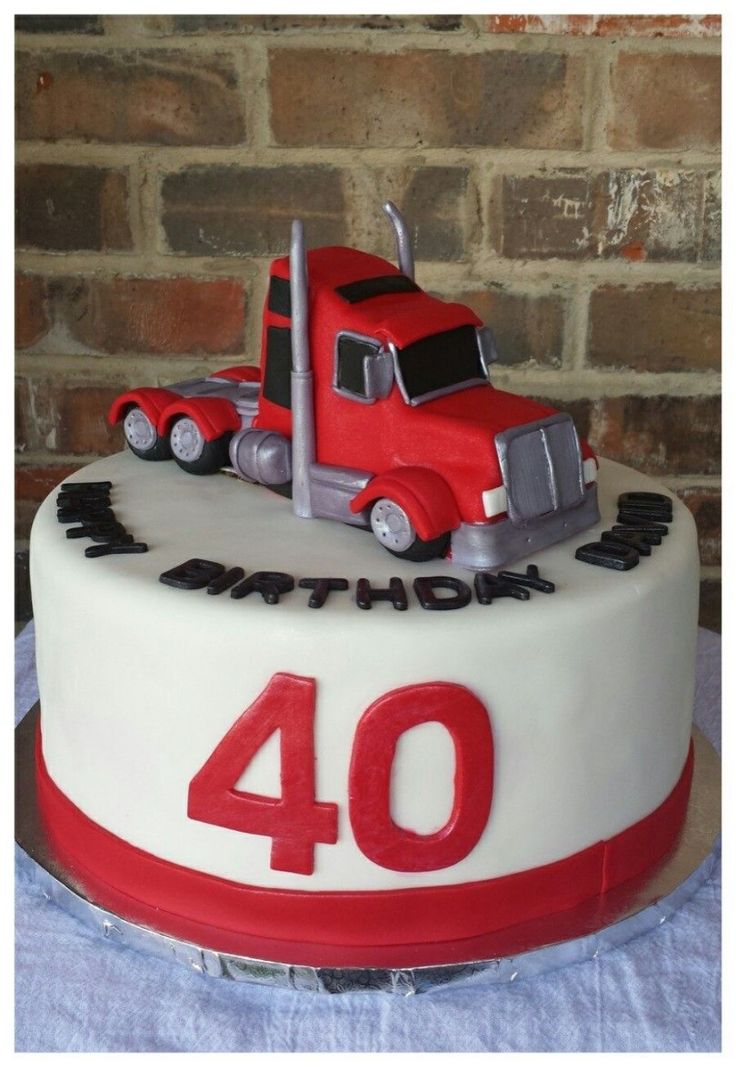 a red and white birthday cake with a truck on the top that says 40 years old