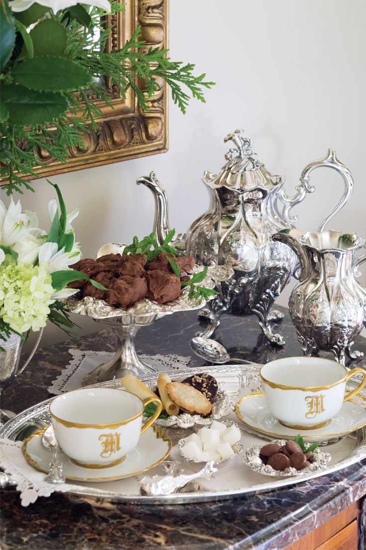 there is a tray with tea and cookies on it