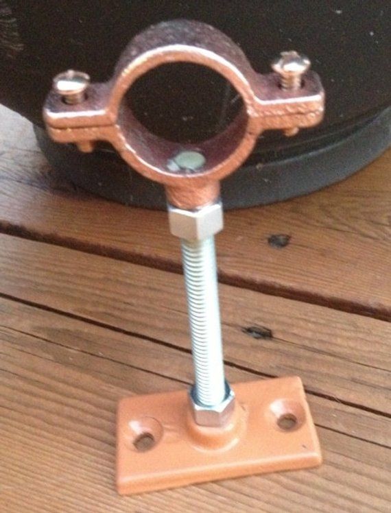 a metal object sitting on top of a wooden table