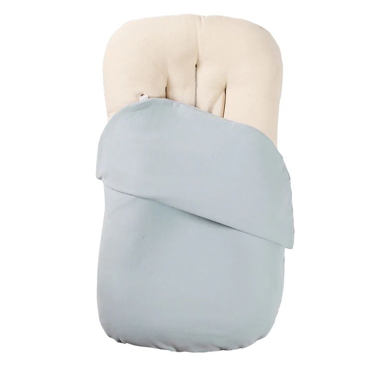 a baby sleeping bag with a pillow on top