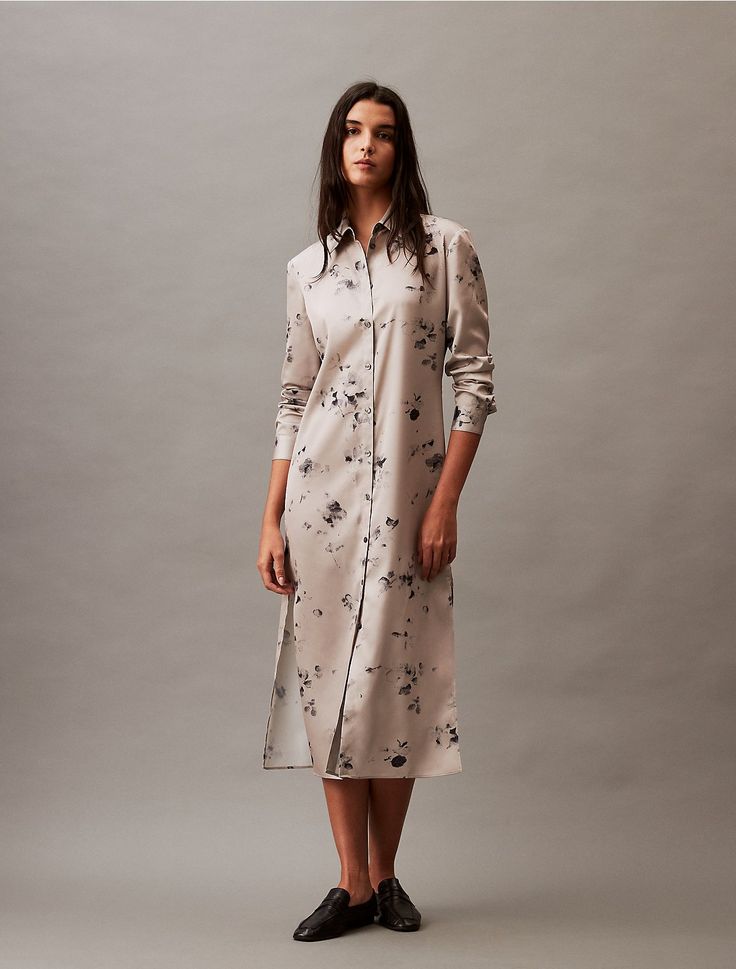 A sumptuous shirt dress, adorned with blossom printing in satin georgette fabric. Styled with a classic point collar, button-front closures, and button barrel cuffs. Side vents at the hem finish off this effortless, elevated design.  Material: 100% Polyester. Chic Button-up Silk Shirt Dress, Elegant Shirt Dress With Button Cuffs And Spread Collar, Elegant Shirt Dress With Spread Collar And Button Cuffs, Elegant Collared Shirt Dress With Cuffed Sleeves, Elegant Button-up Shirt Dress With Cuffed Sleeves, Silk Shirt Dress For Daywear In Fall, Silk Shirt Dress For Fall Daywear, Elegant Silk Collared Shirt Dress, Fall Silk Shirt Dress For Daywear