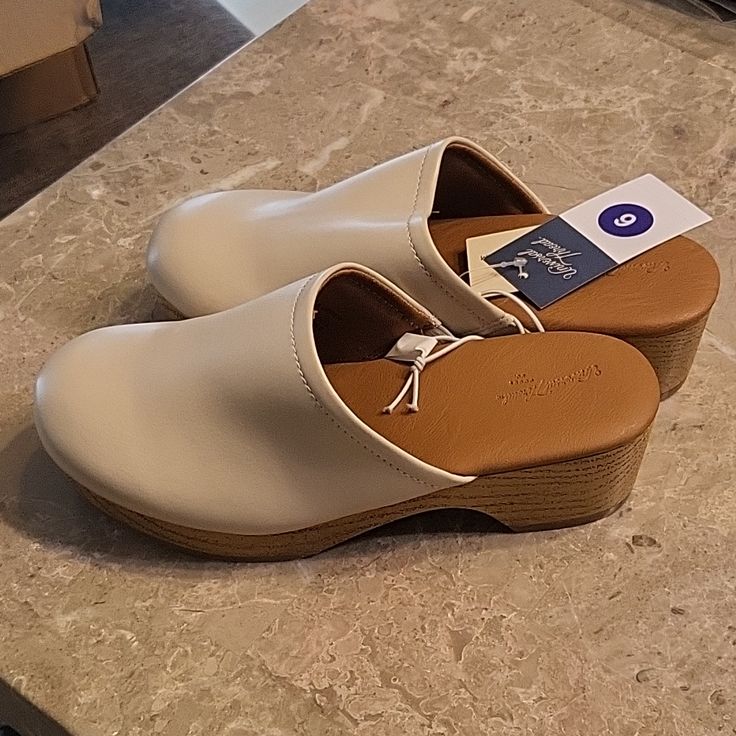 Cream Colored Magnolia Clogs By Universal Thread. Memory Foam Insoles, Wood Grain Medium Heel, Size 6. Spring Slip-resistant Slip-on Clogs, Spring Slip-on Slip-resistant Clogs, Casual Cream Clogs With Cushioned Footbed, Spring Synthetic Clogs Of Medium Width, Medium Width Synthetic Clogs For Spring, Synthetic Clogs With Removable Insole, Medium Width, Comfortable Closed Toe Synthetic Clogs, Comfortable Synthetic Closed Toe Clogs, Slip-resistant Round Toe Clogs For Spring