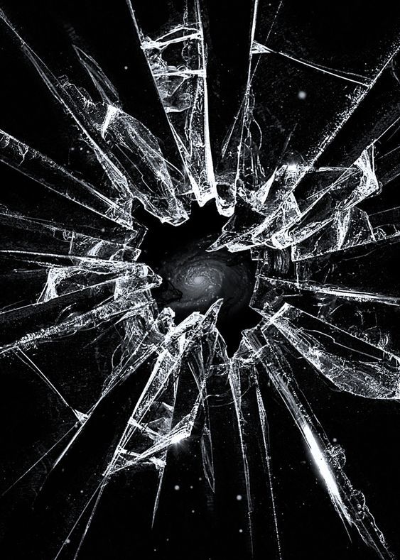 a broken glass window that has been shattered